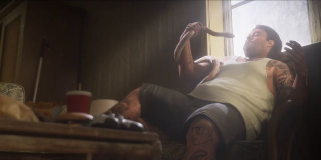 A pet snake on a couch. Still from official footage, Rockstar Games