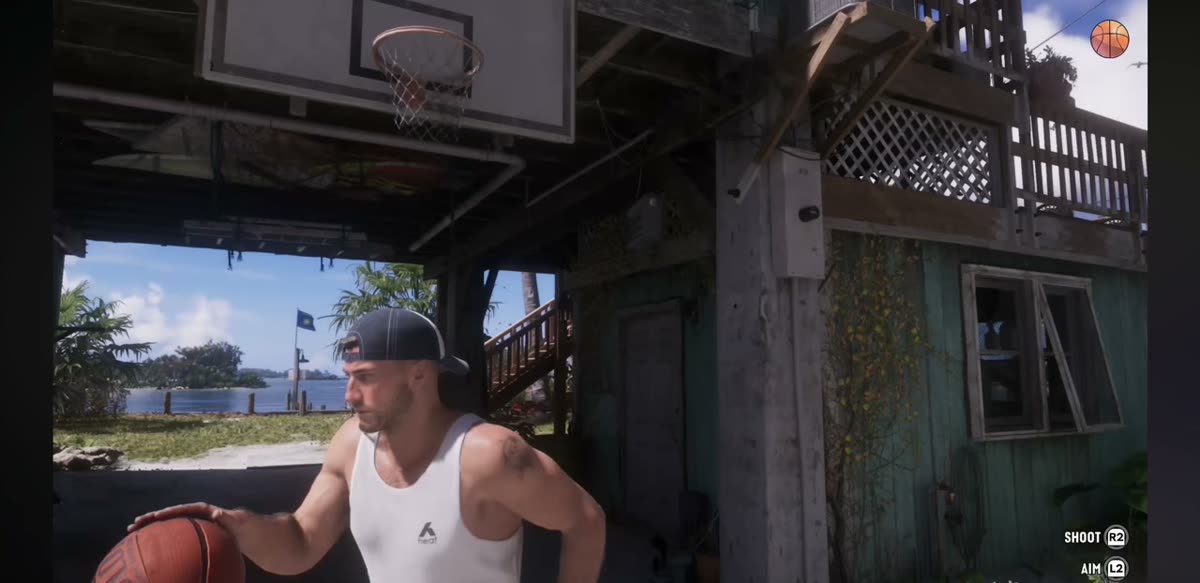 A street basketball court in GTA 6 with shoot and aim prompts
