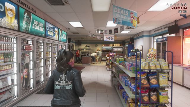 A convenience store, mid robbery. Still from official footage, Rockstar Games