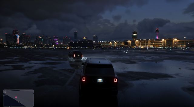 Black SUVs on the airport apron. Still from official footage, Rockstar Games