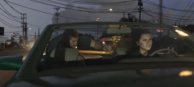 Jason and Lucia in a convertible. Still from official footage, Rockstar Games