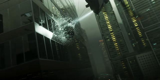 A helicopter searchlight, windows shattering. Still from official footage, Rockstar Games