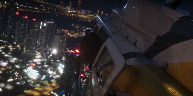 Hanging off a helicopter over the city. Still from official footage, Rockstar Games