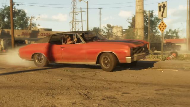 A red muscle car leaving a robbery. Still from official footage, Rockstar Games